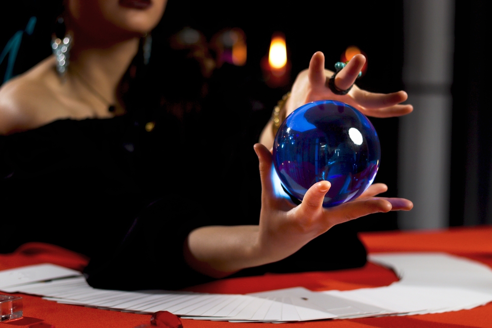 A clairvoyant reading a crystal ball