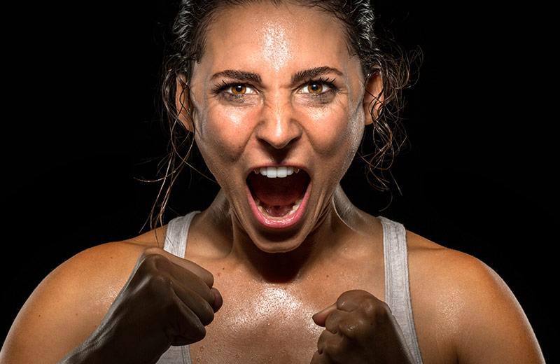 Female athlete screaming into the camera