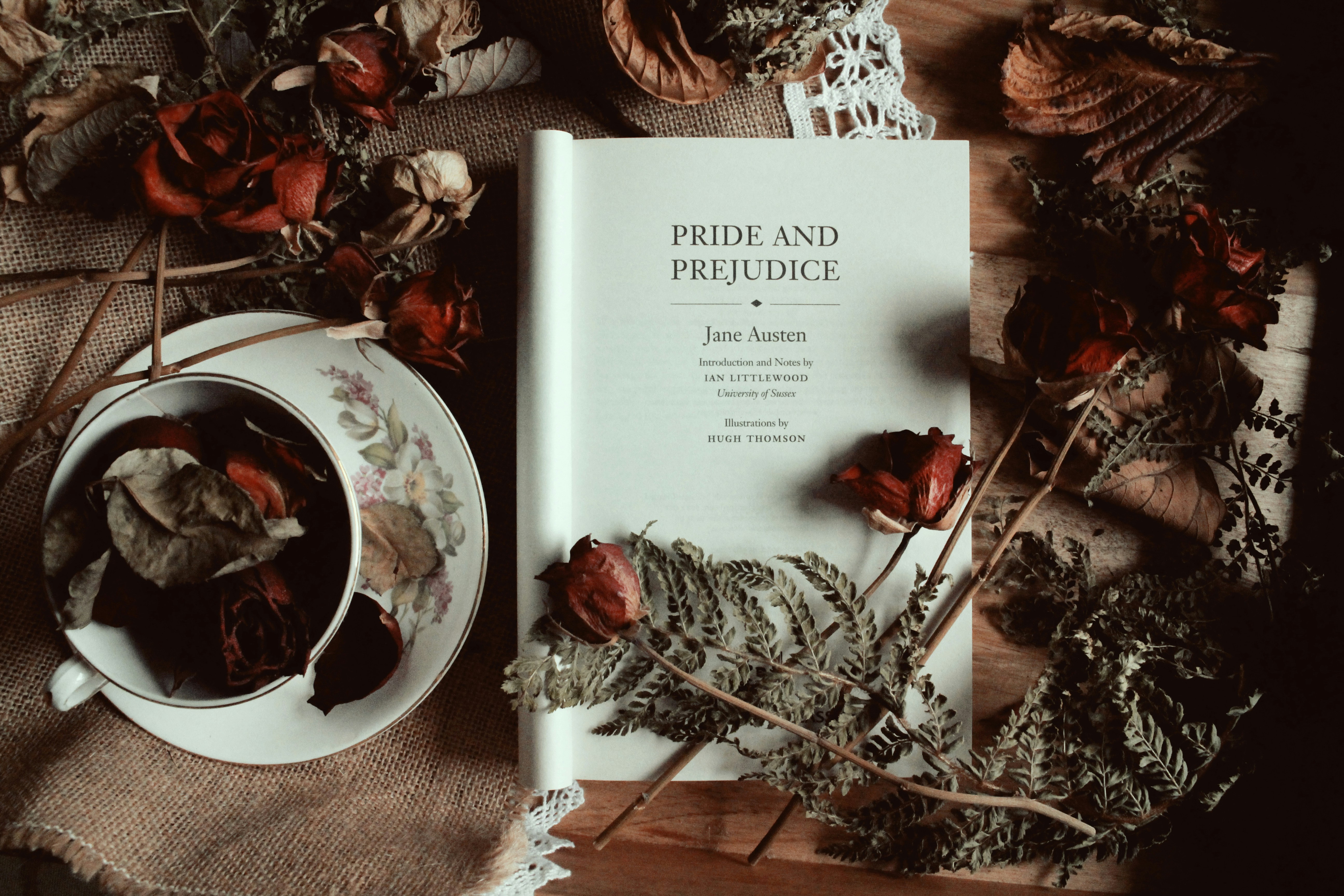 Pride and Prejudice Novel Open with Roses on it. 