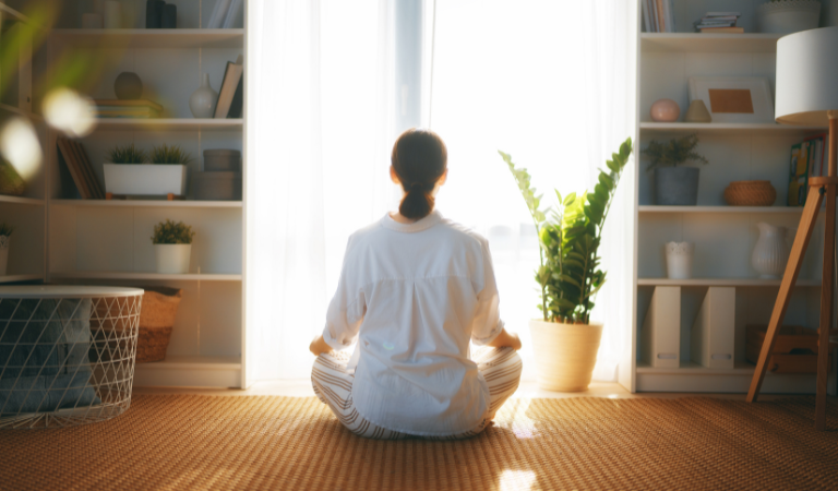 person meditating at home