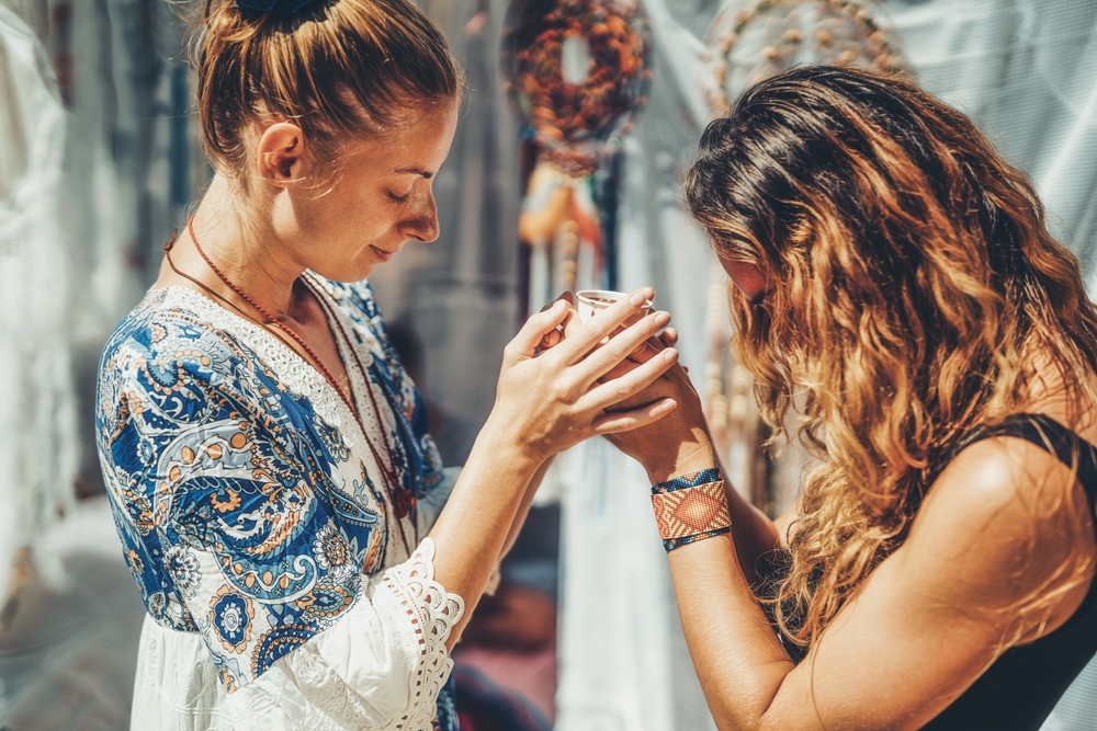 Two women participating in a Cacao Ceremony