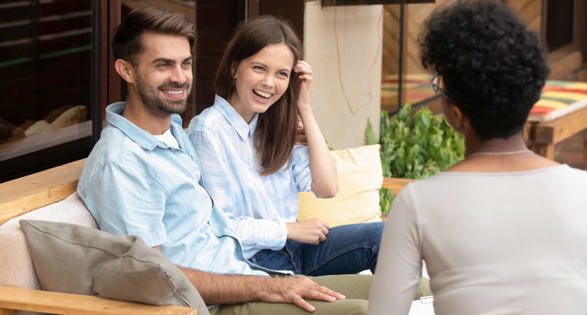 A wedding planner consulting with the happy couple. 