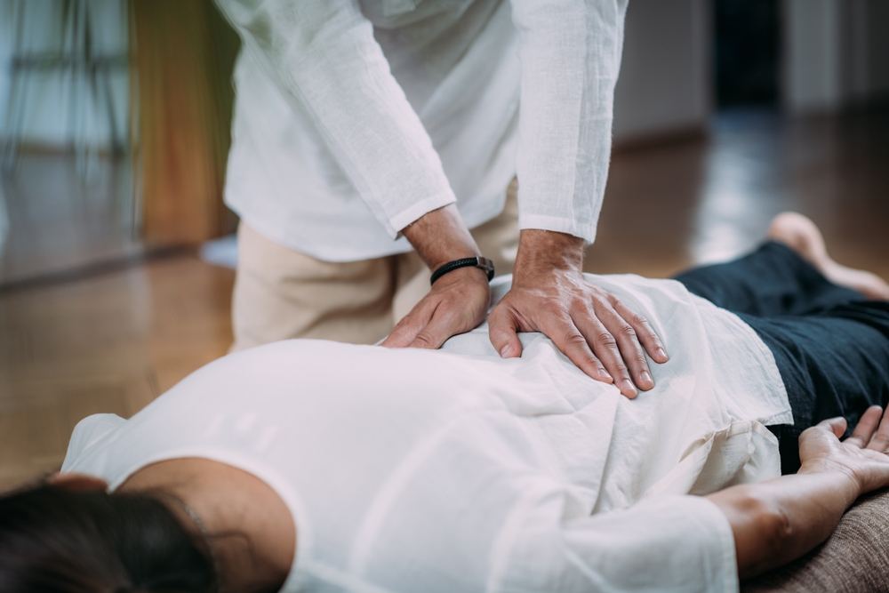 Woman receiving a Shiatsu massage clothed