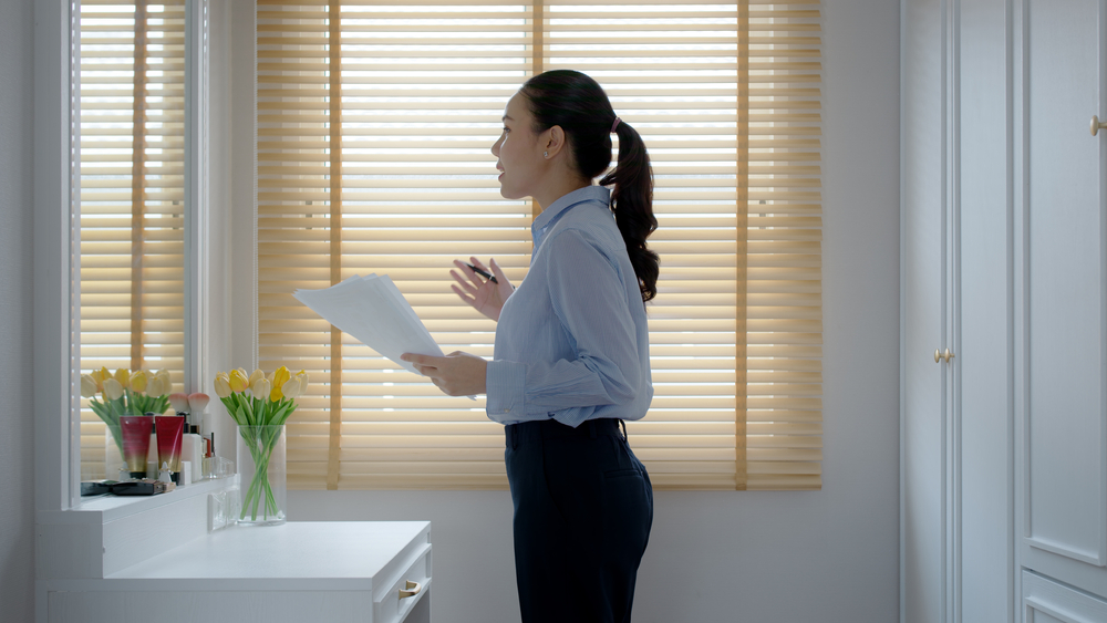 Woman practicing her speech in a mirror