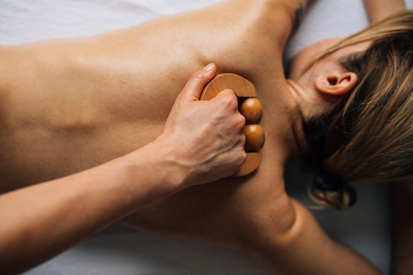 Woman receiving a bamboo massage.