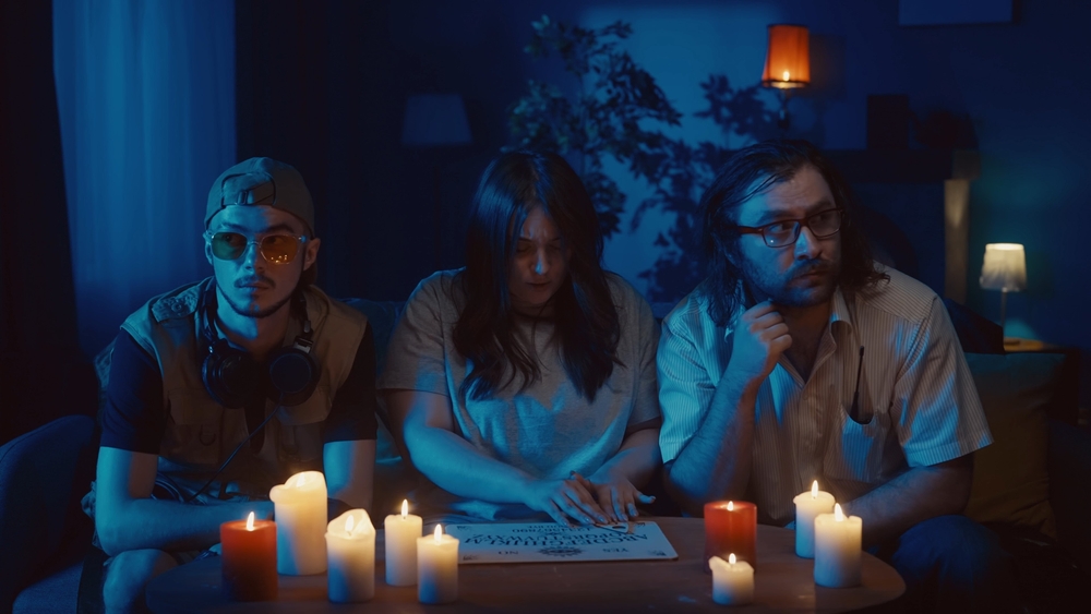 Three people doing a seance