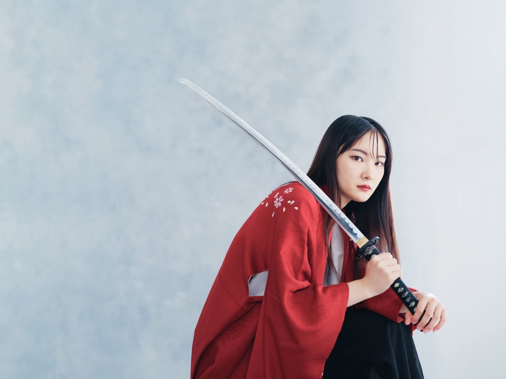 Female Samurai Holding Sword and Looking at the Camera.