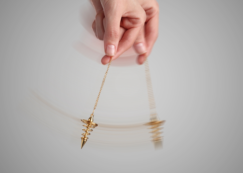 Dowsing pendulum in motion